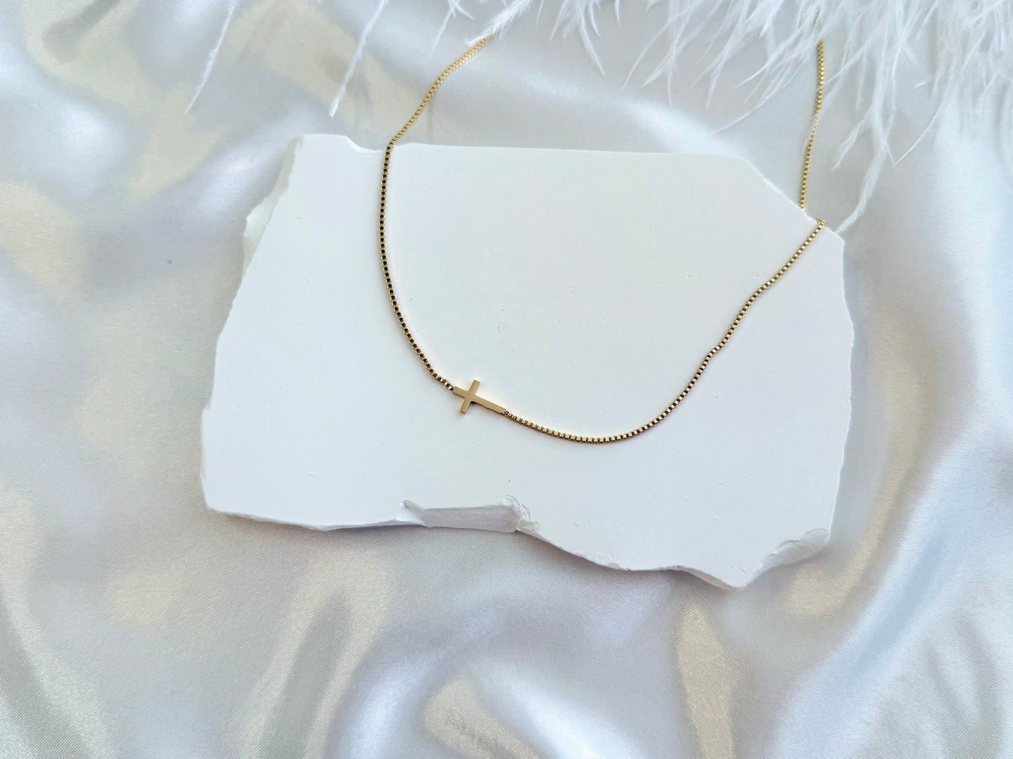 Sideways cross necklace