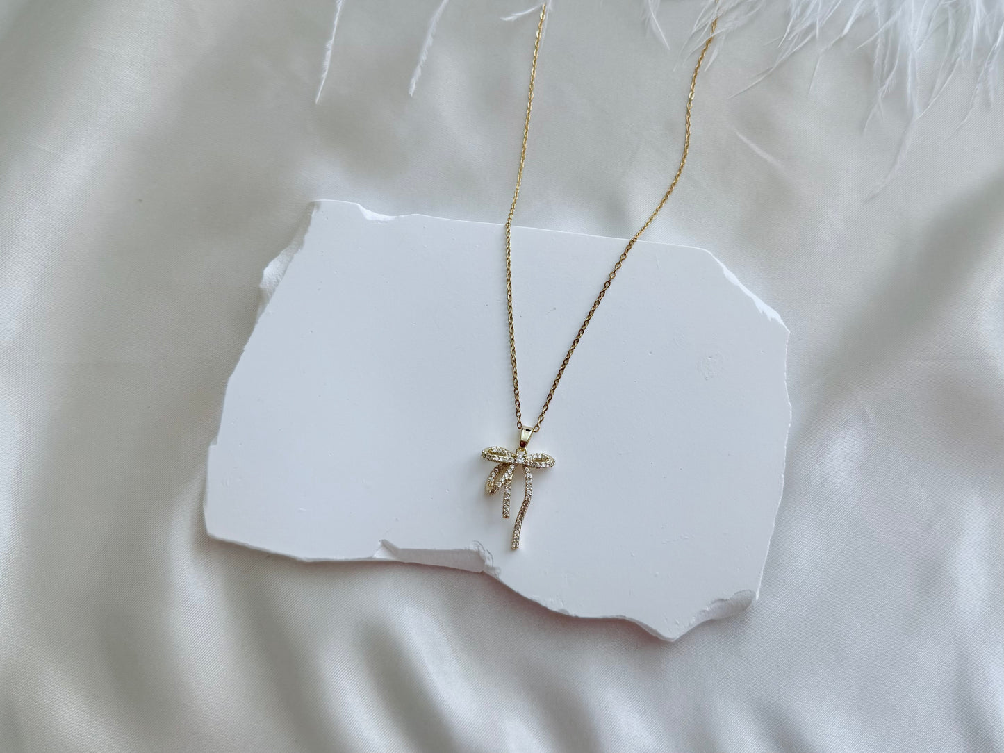 Diamonte bow necklace