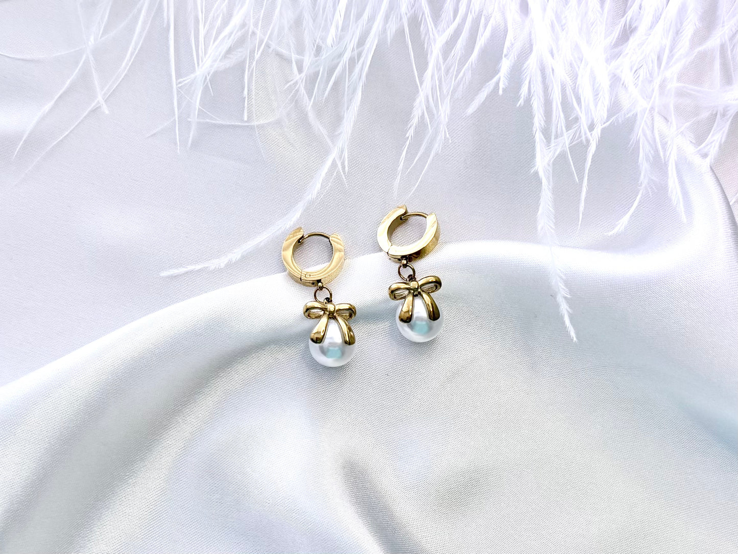 Pearl bow drop earrings