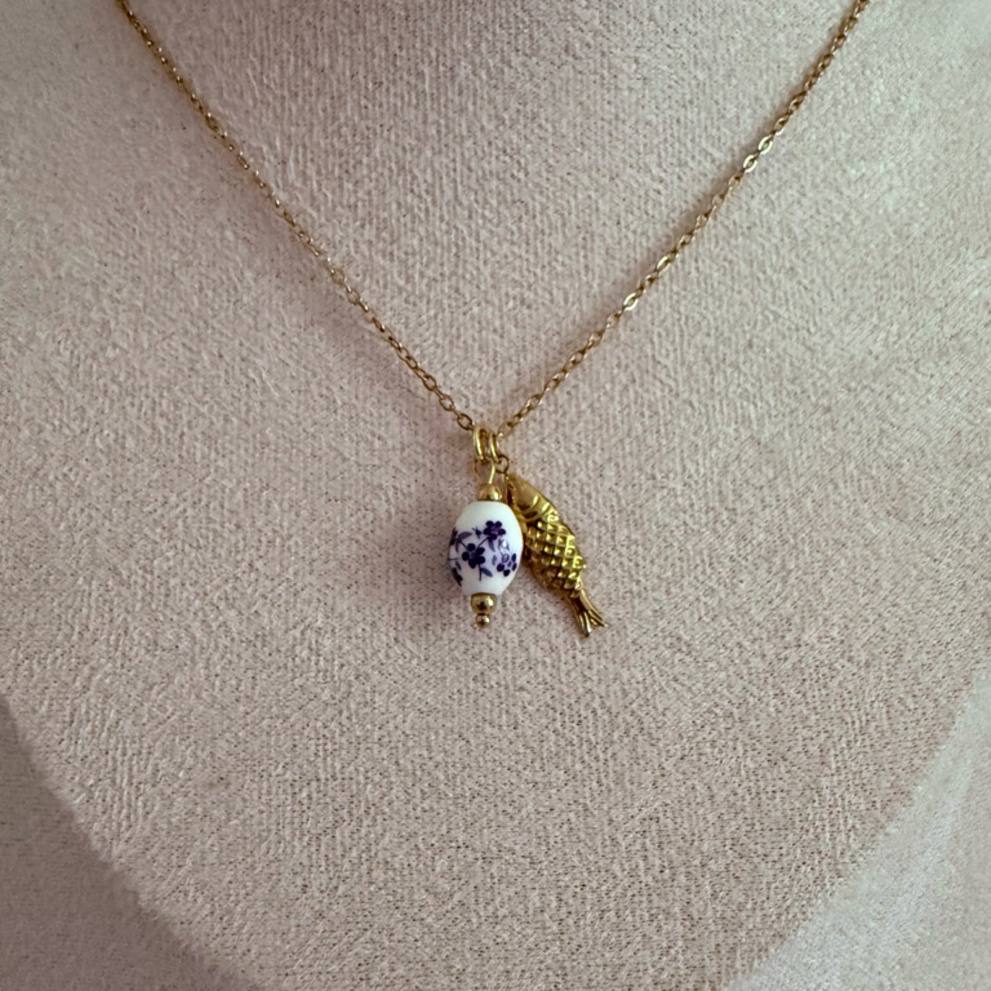 Pearl drop fish charm necklace