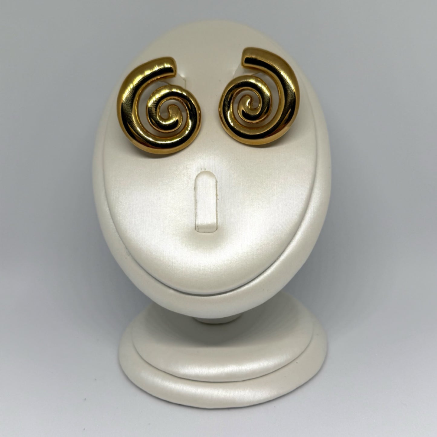 Spiral statement stud earrings gold